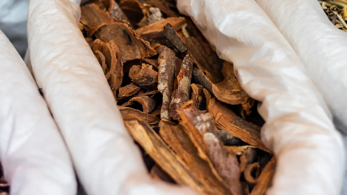 Close-up of dried bark used for herbal tea, captured in São Paulo market.
